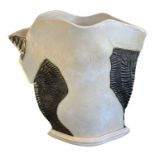 † SANDRA BARNETT; a studio pottery type vase modelled as a nude female, height 33cm, width 28cm.