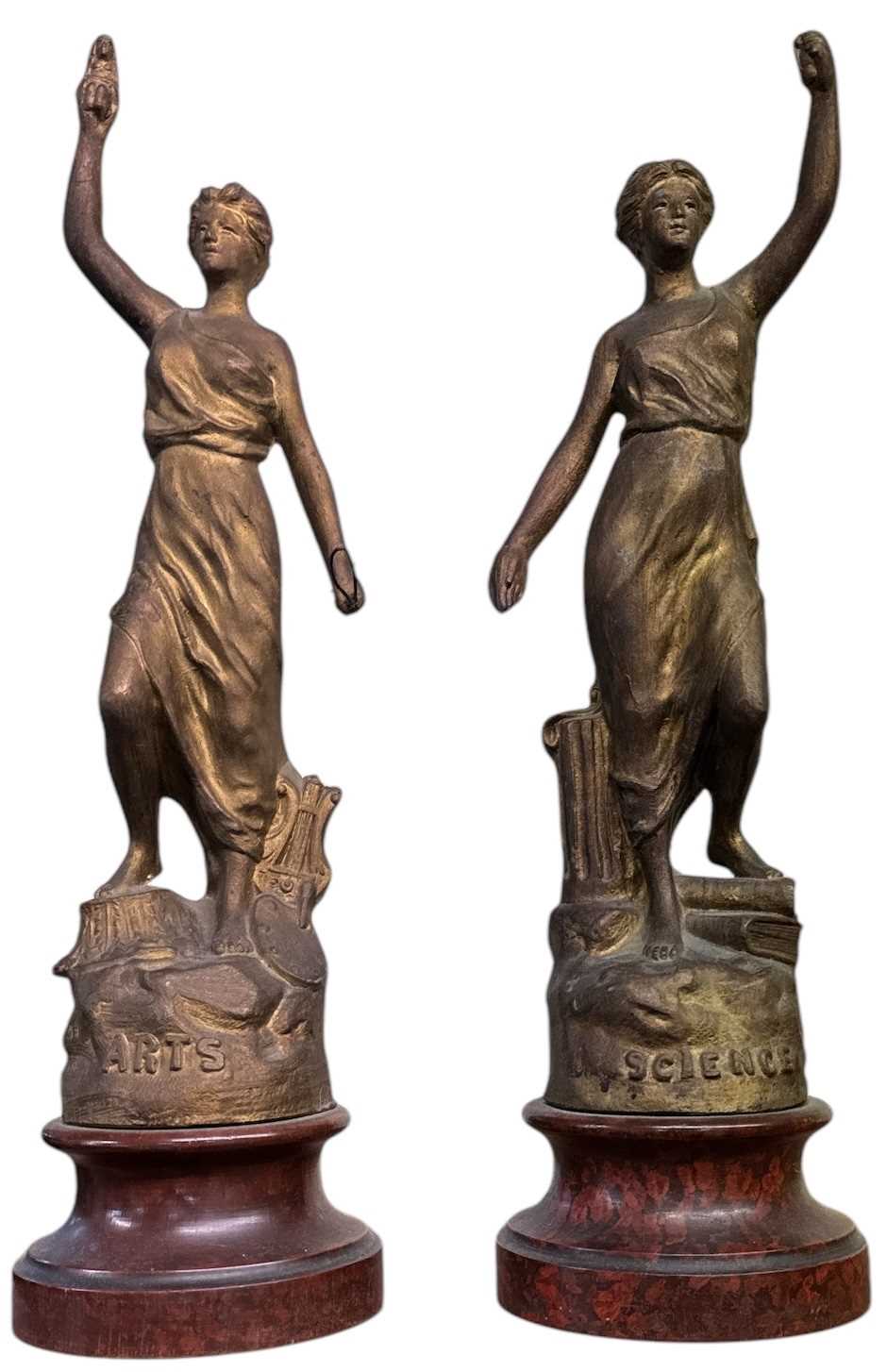 A pair of gilt spelter models of females, representing Arts and Science, height 39cm.