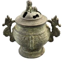 A Chinese archaic style lidded bronze censer, with twin handles modelled as dragons and a lion to