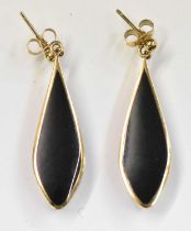 A pair of 9ct yellow gold onyx set teardrop shaped earrings, combined approx 5.1g.