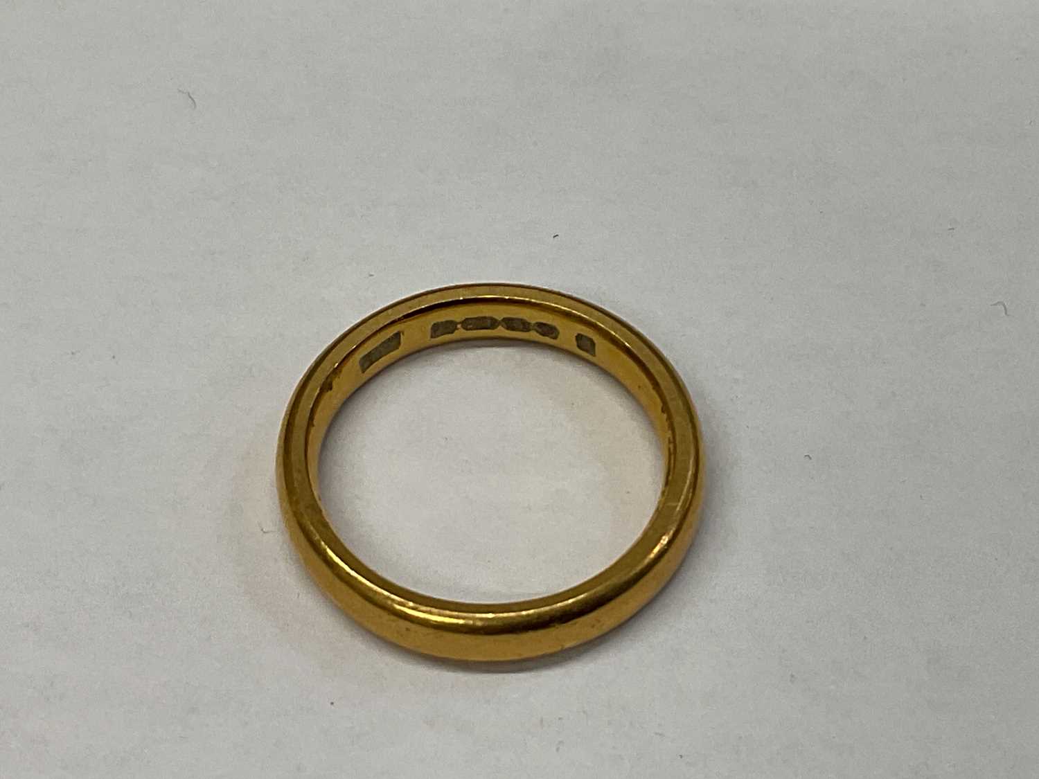 A 22ct yellow gold wedding band, size J, approx 5.6g. - Image 2 of 2