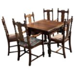 A 1920s oak draw-leaf dining table on barley twist supports, with six chairs (4+2).