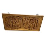 A large modern Chinese carved wooden wall hanging plaque showing ladies amongst foliage, 50 x