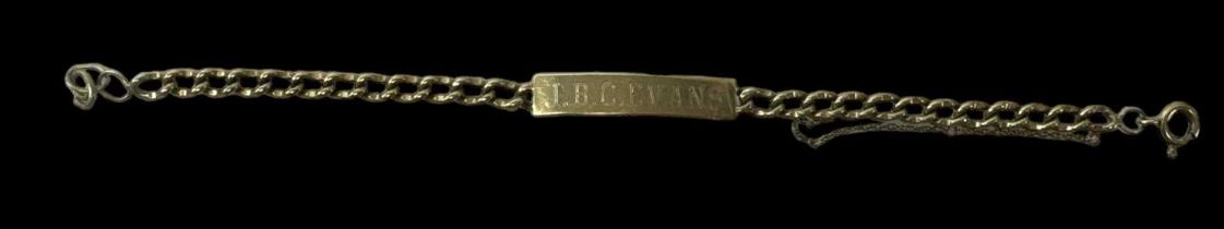 A 9ct yellow gold identity bracelet inscribed 'J.B.C. Evans', length 21cm, approx 14.5g.