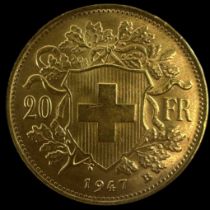 A Swiss 1947 twenty francs gold coin.