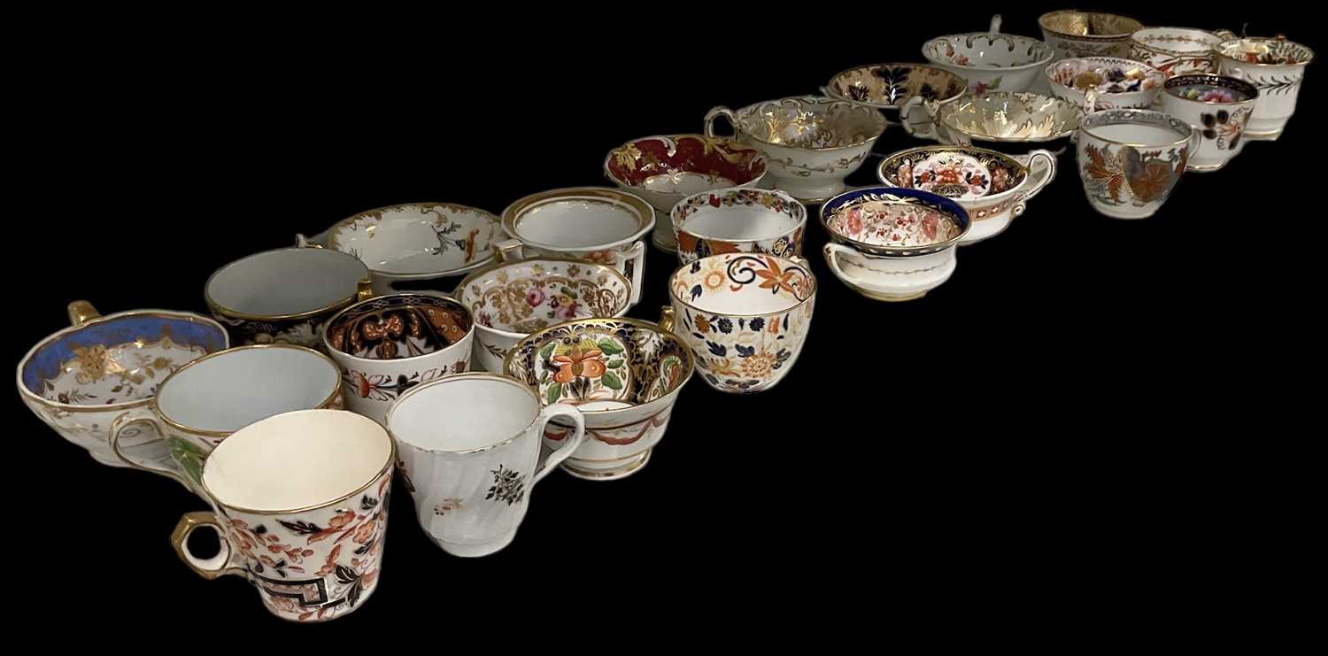 A group of twenty-five 19th century and later teacups including Imari examples.