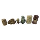 A group of Chinese carved hardstone and soapstone figures including a green hardstone Dog of Fo,