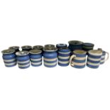 A quantity of Cornish blue and white kitchenware including eleven lidded jars, two further jars, a