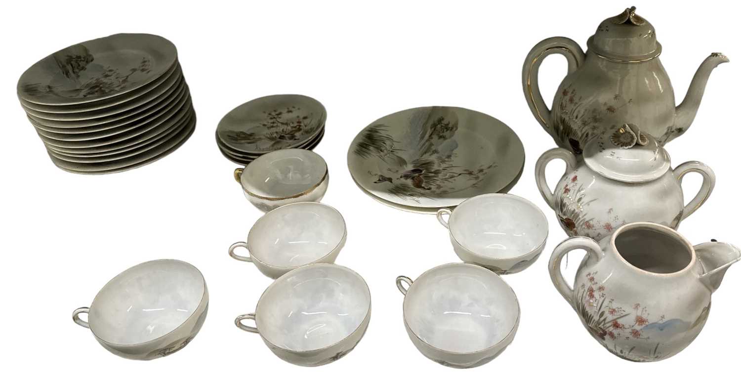 A modern Japanese eggshell porcelain six setting part tea service, comprising six teacups, four
