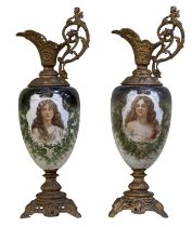 A pair of 19th century opaque glass hand painted gilt mounted ewers, the glass painted with