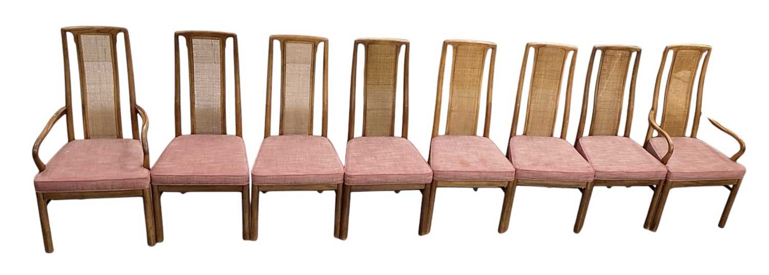 DREXEL HERITAGE FURNISHINGS; a set of eight rattan backed dining chairs with red upholstered