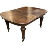 A Victorian oak extending wind-out dining table with additional leaf, top when not extended 150 x