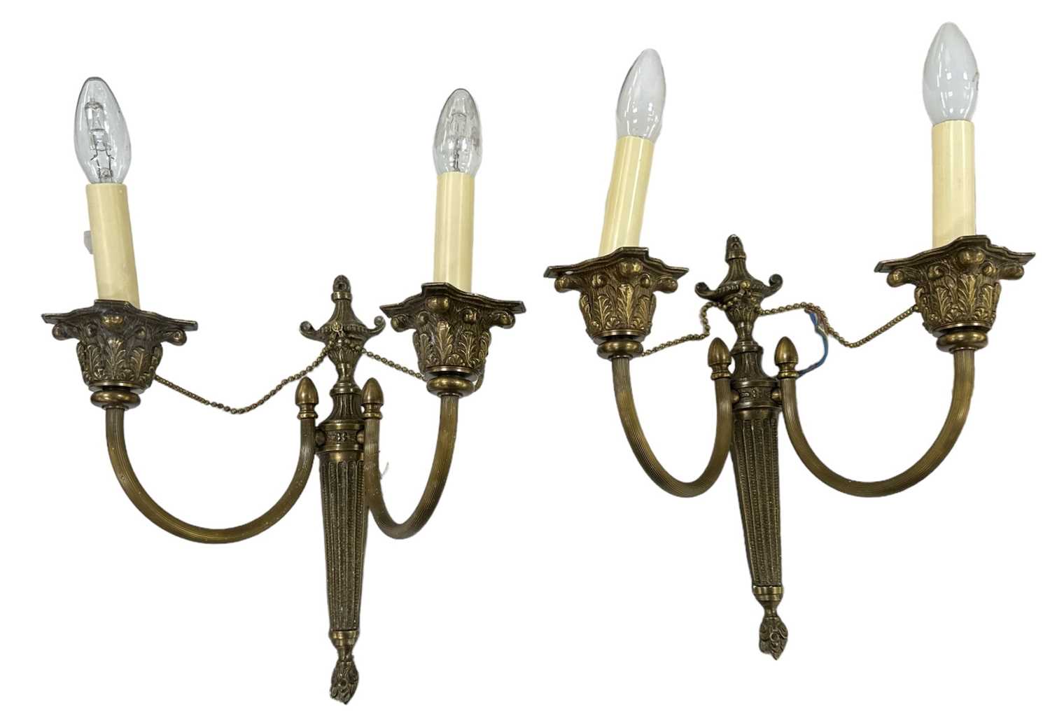 A pair of brass two branch wall lights, height approx 45cm.