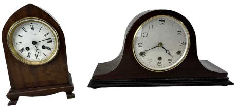 A 20th century mahogany cased mantel clock, the white enamel dial set with Roman numerals, and a