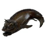 A late 18th/early 19th century Chinese bronze dragon carp censer, with removable lid, height 24cm.