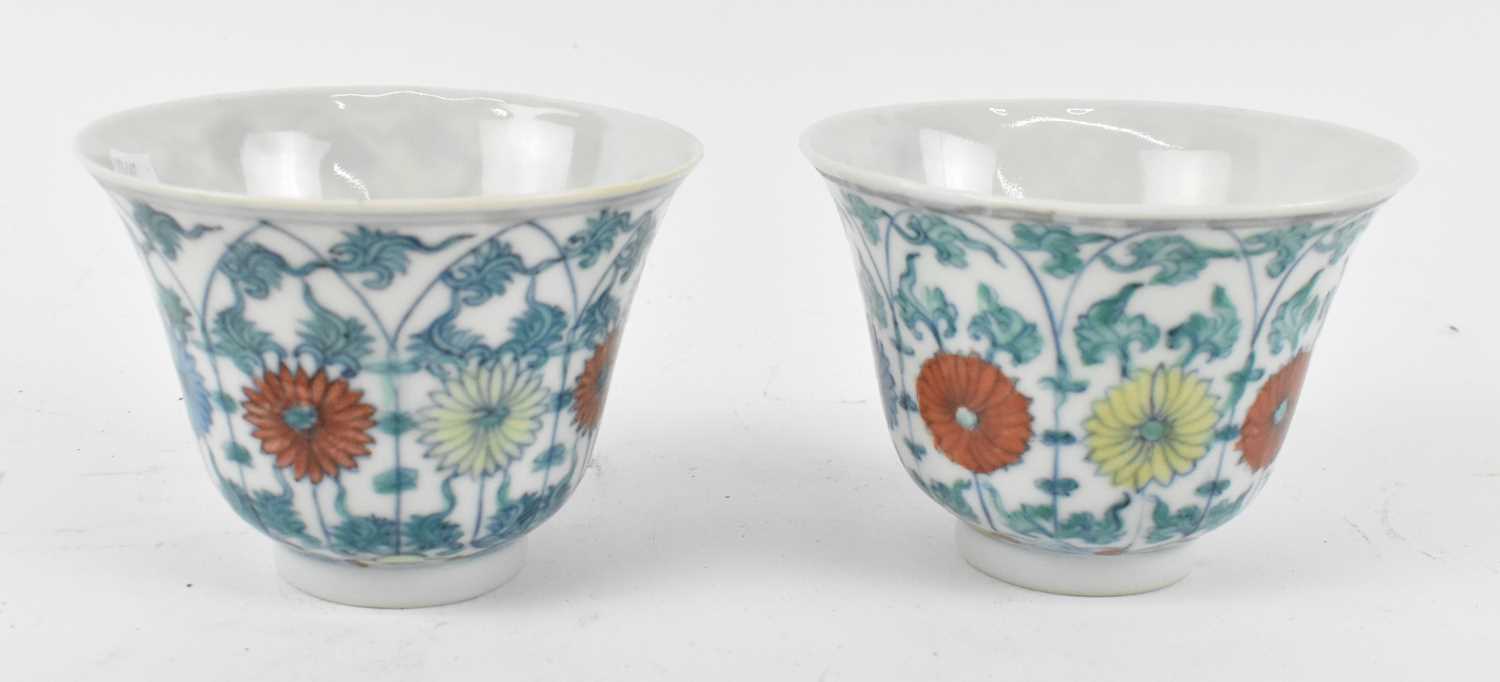 A pair of Chinese Republic period porcelain bowls, painted in enamels and decorated with lotus