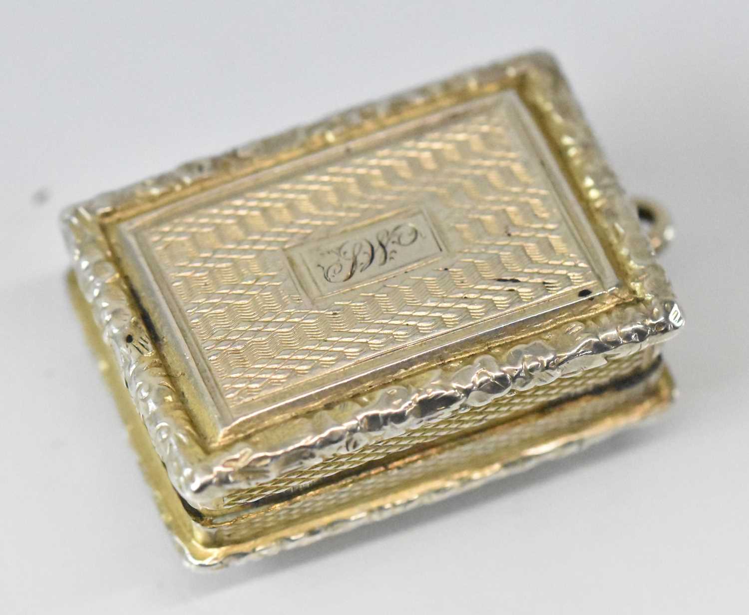 JOHN BETTRIDGE; a George IV hallmarked silver vinaigrette with elaborate pierced gilt interior,