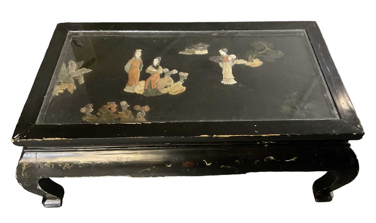 A 20th century Chinese ebonised and hardstone set glass topped coffee table, 102 x 56cm.