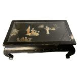 A 20th century Chinese ebonised and hardstone set glass topped coffee table, 102 x 56cm.