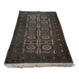 A Persian silk cream and brown ground carpet with geometric design, 195 x 125cm.