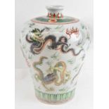 A Chinese porcelain vase decorated with dragons, with a six character mark to base, height 33cm.
