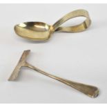 A J BAILEY; a George V hallmarked silver spoon and food pusher, Birmingham 1931, combined approx 0.