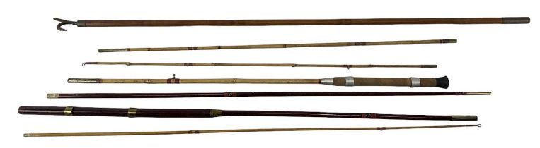 A group of fishing related equipment including two fishing rods.