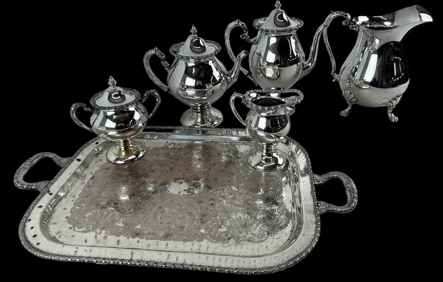 A four piece silver plated tea and coffee service on twin handled tray comprising teapot, coffee