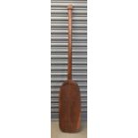 A 19th century South Seas tribal paddle with alover incised decoration, length 153cm.