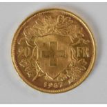 A 1947 Swiss franc gold coin, diameter 2cm, approx 6.5g.