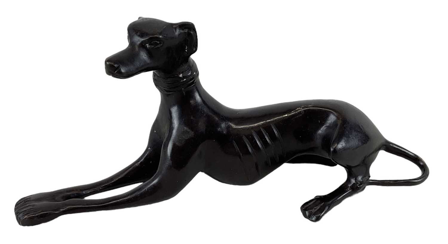 A white bronzed metal of a greyhound, height 9cm, length 21cm.