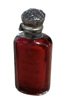 A 19th century white metal mounted red glass scent bottle, height 6.5cm.