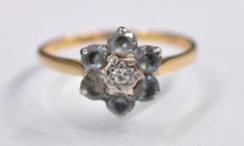 An 18ct yellow gold diamond and aquamarine set flower head ring, size Q, approx 3.25g.
