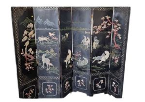 A 20th century Chinese five-fold six leaf hardstone set room dividing screen, decorated with