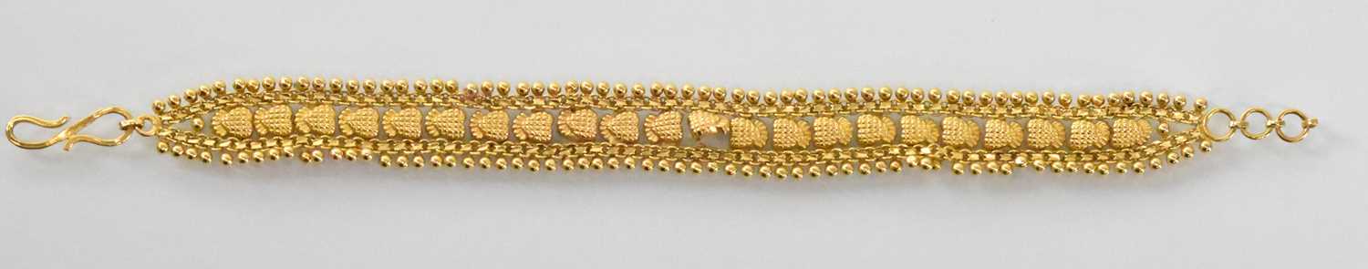 An Indian 22ct yellow gold fine link bracelet, length 18.5cm, approx 12.7g. Condition Report: Please