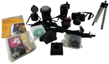 A quantity of cameras and lenses including a Pentax Asahi camera, Tamron 28mm lens, Pentax lens,