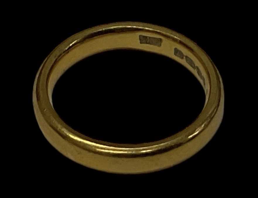 A 22ct yellow gold wedding band, size J, approx 5.6g.