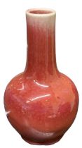 A Chinese red glazed vase, four character mark to base, height 18.5cm.