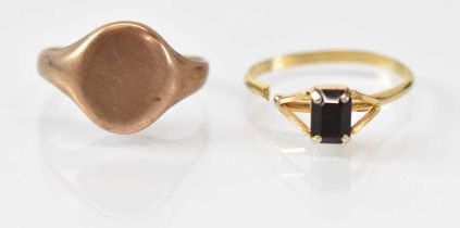 A 9ct yellow gold signet ring (cut) and a yellow metal red stone set ring (cut), combined approx 6.