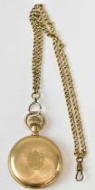 WALTHAM; a 14ct yellow gold hunter cased pocket watch with white enamel dial, on yellow metal chain,