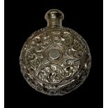 A Continental white metal scent bottle, the body of circular form, with carved floral decoration,