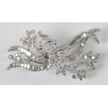A fine Art Deco style precious white metal diamond encrusted floral brooch, length 8cm, diamonds