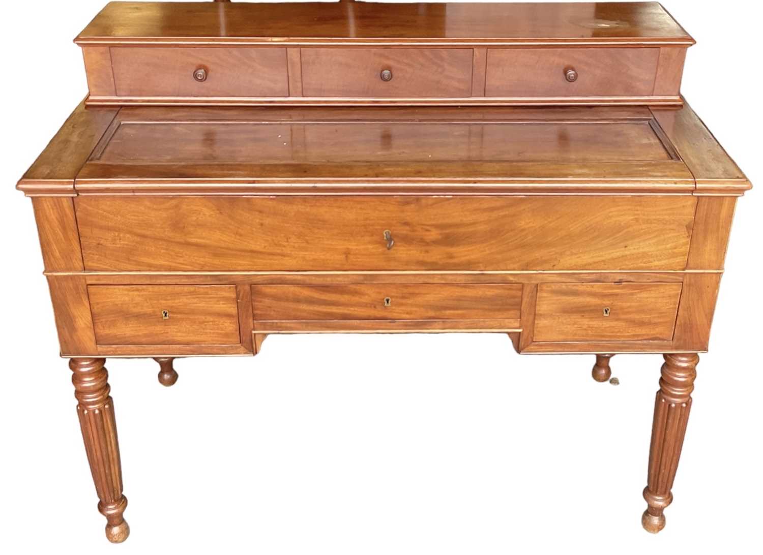 A 19th century mahogany writing desk, with secretaire drawer, fitted interior and three drawers,