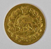 A small Persian/Iranian gold coin with a lion to the front, diameter 1.7cm, approx 1.5g.
