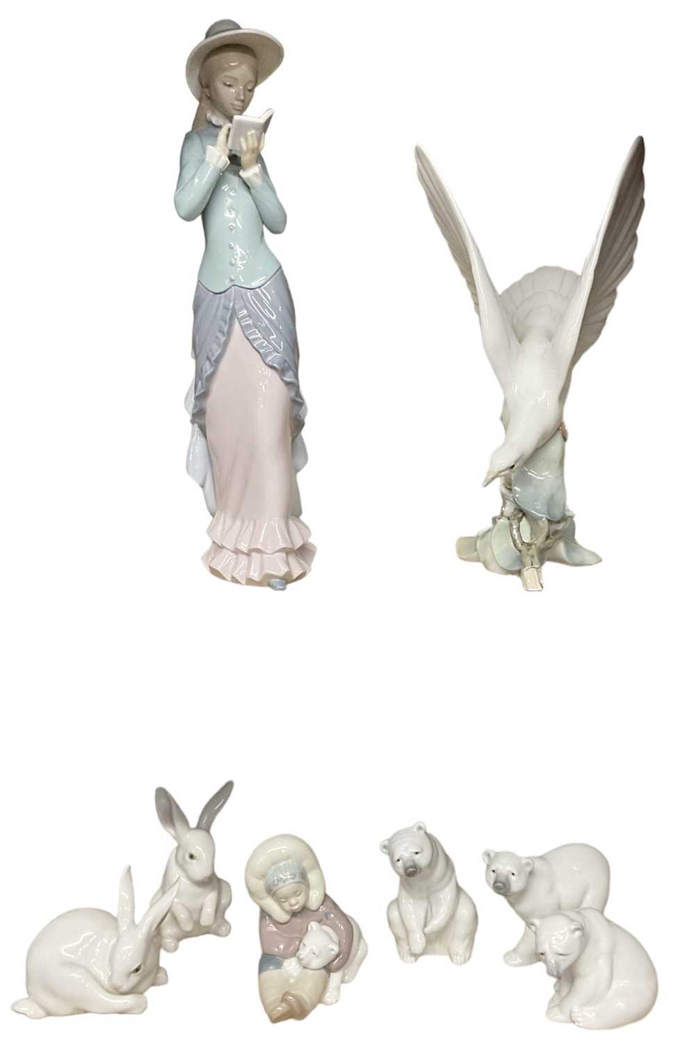 LLADRÓ ; a porcelain blue, green and pale pink decorated figure of a lady, height 36cm, a