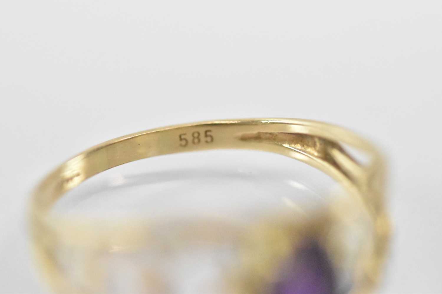 A 14ct yellow gold ring set with central purple stone, size M, approx 1.7g. - Image 3 of 3