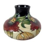 MOORCROFT; a 'Anna Lily' pattern vase, marks to base, height 16.5cm, boxed.