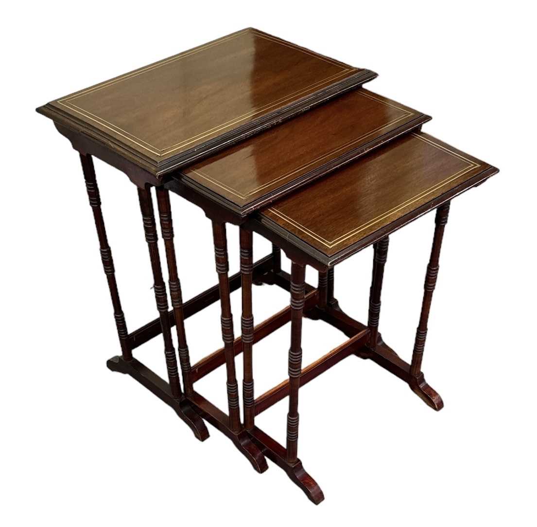 A nest of three mahogany and brass inlaid occasional tables, top 57 x 39cm. - Image 2 of 2