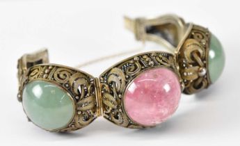 A Chinese silver gilt jade and rose quartz set articulated bracelet, approx 71g.