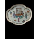 A 19th century Chinese Famille Rose porcelain dish decorated with an interior scene showing